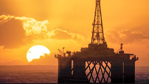 Silhouette of an oil rig at sunset. Silhouette of an oil rig at sunset.