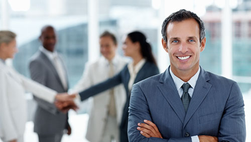 Engineers and businesspeople smile and shake hands. Engineers and businesspeople smile and shake hands.